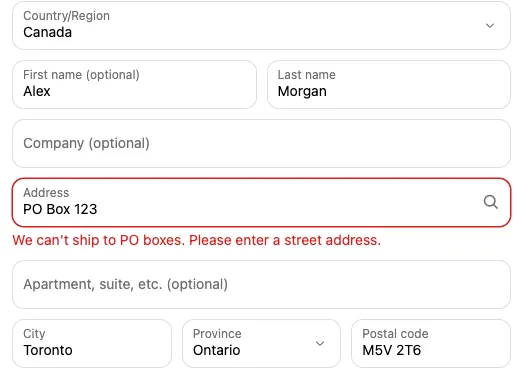 Checkout showing the address blocker’s error under the Address field: ‘We can’t ship to PO boxes. Please enter a street address.’